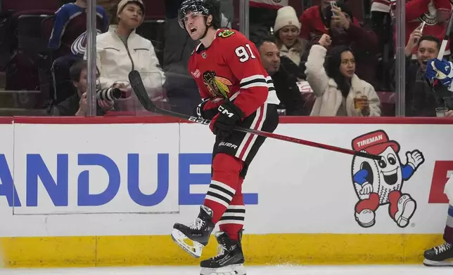 Chicago Blackhawks center Frank Nazar (91) celebrates after scoring on the Colorado Avalanche during the second period of an NHL hockey game Wednesday, Jan. 8, 2025, in Chicago. (AP Photo/Erin Hooley)