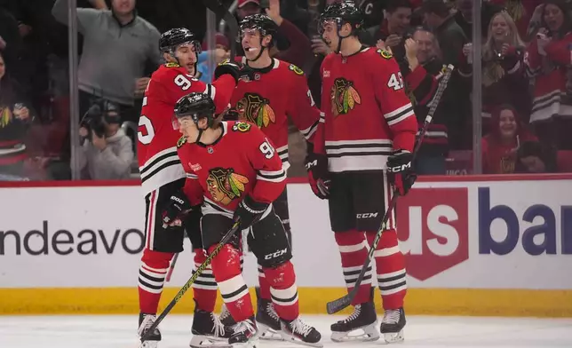 Chicago Blackhawks center Connor Bedard (98) skates back to the bench after getting the puck past Colorado Avalanche goaltender Trent Miner (50) but it is declared no goal during the second period of an NHL hockey game Wednesday, Jan. 8, 2025, in Chicago. (AP Photo/Erin Hooley)