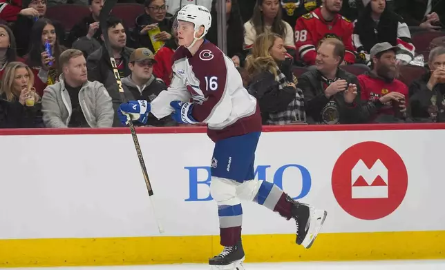 Colorado Avalanche center Juuso Parssinen (16) skates to the bench after scoring on the Chicago Blackhawks during the first period of an NHL hockey game Wednesday, Jan. 8, 2025, in Chicago. (AP Photo/Erin Hooley)