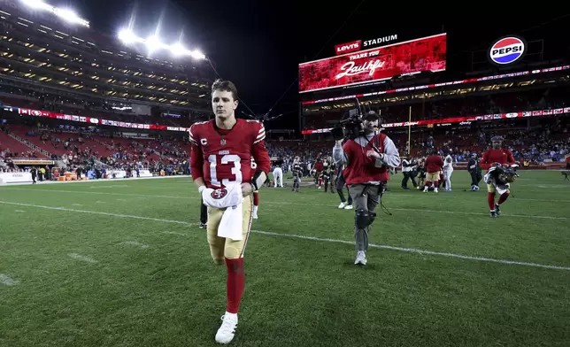 San Francisco 49ers quarterback Brock Purdy (13) walks off the field after a loss to the Detroit Lions in an NFL football game Monday, Dec. 30, 2024, in Santa Clara, Calif. (AP Photo/Jed Jacobsohn)