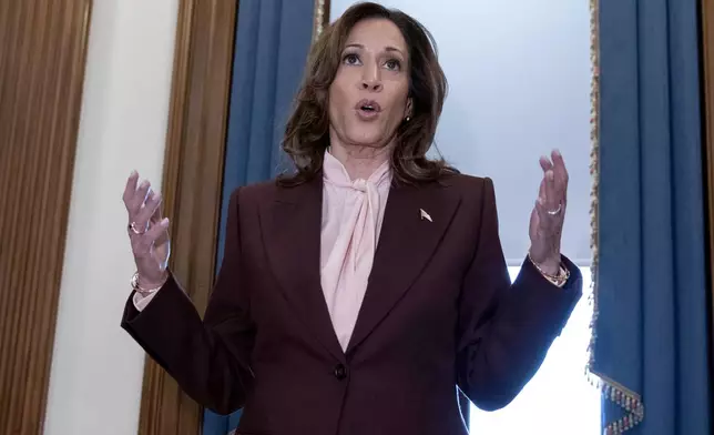 Vice President Kamala Harris talks to reporters after presiding over a joint session of congress to confirm the Electoral College votes at the Capitol, Monday, Jan. 6, 2025, in Washington. (AP Photo/Jose Luis Magana)