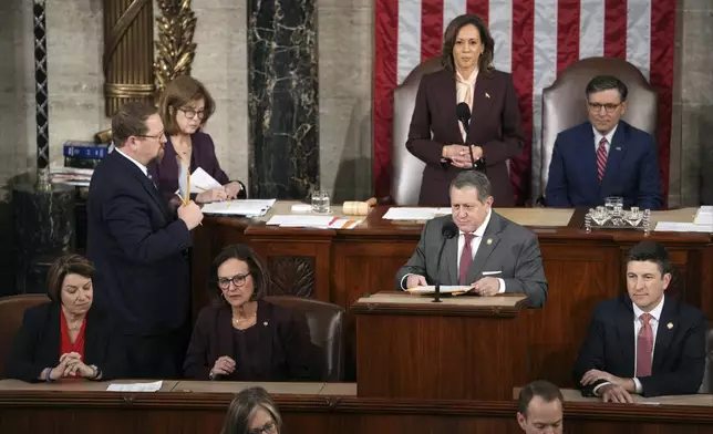 Vice President Kamala Harris and House Speaker Mike Johnson of La., listen as Rep. Joseph Morelle, D-N.Y., reads a certification during a joint session of Congress to confirm the Electoral College votes, affirming President-elect Donald Trump's victory in the presidential election, Monday, Jan. 6, 2025, at the U.S. Capitol in Washington. (AP Photo/Matt Rourke)