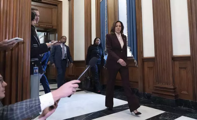 Vice President Kamala Harris walks to speak with reporters after presiding over a joint session of congress to confirm the Electoral College votes at the Capitol, Monday, Jan. 6, 2025, in Washington. (AP Photo/Jose Luis Magana)