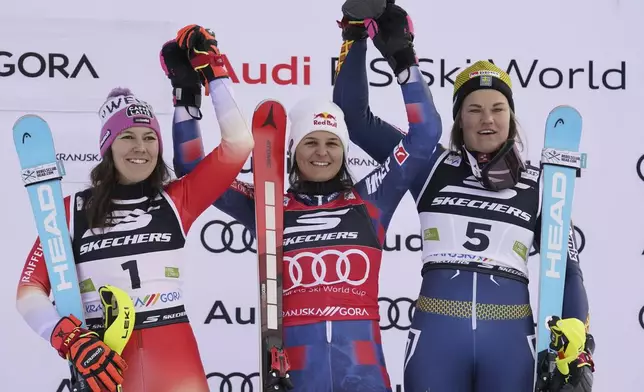 From left, second placed Switzerland's Wendy Holdener, the winner Croatia's Zrinka Ljutic and third placed Sweden's Anna Swenn Larsson celebrate after an alpine ski, women's World Cup slalom race, in Kranjska Gora, Slovenia, Sunday, Jan. 5, 2025. (AP Photo/Piermarco Tacca)