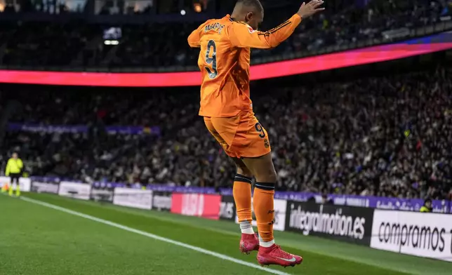 Real Madrid's Kylian Mbappe celebrates after scoring his side's second goal during the Spanish La Liga soccer match between Valladolid and Real Madrid at the Jose Zorrilla stadium in Valladolid, Spain, Saturday, Jan. 25, 2025. (AP Photo/Manu Fernandez)