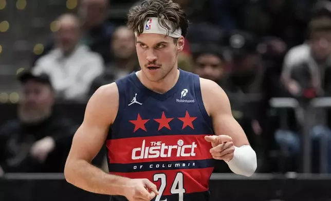 Washington Wizards forward Corey Kispert gestures after scoring a three-pointer against the Houston Rockets during the first half of an NBA basketball game Tuesday, Jan. 7, 2025, in Washington. (AP Photo/Jess Rapfogel)