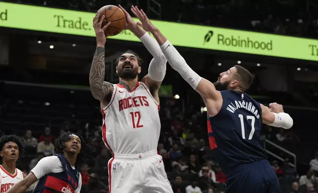 Houston Rockets center Steven Adams (12) goes up for a shot against Washington Wizards center Jonas Valanciunas (17) during the first half of an NBA basketball game Tuesday, Jan. 7, 2025, in Washington. (AP Photo/Jess Rapfogel)