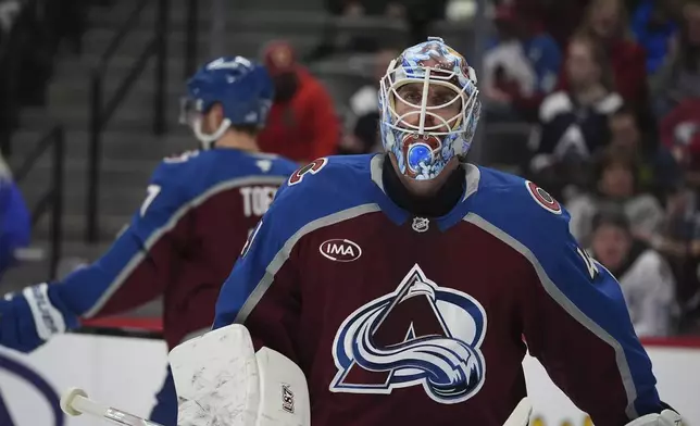 Colorado Avalanche goaltender Scott Wedgewood looks on during a time out in the second period of an NHL hockey game against the Buffalo Sabres Thursday, Jan. 2, 2025, in Denver. (AP Photo/David Zalubowski)