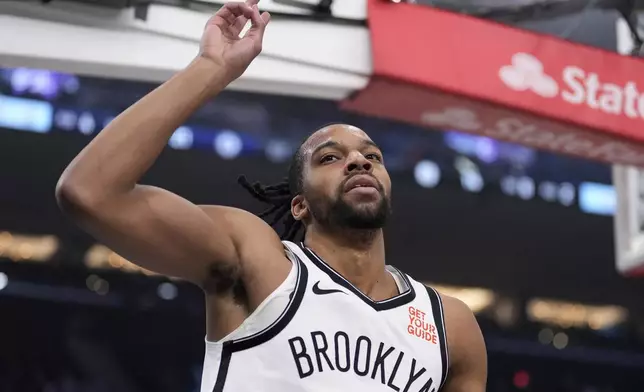 Brooklyn Nets forward Tosan Evbuomwan gestures after scoring during the first half of an NBA basketball game against the Los Angeles Clippers, Wednesday, Jan. 15, 2025, in Inglewood, Calif. (AP Photo/Mark J. Terrill)