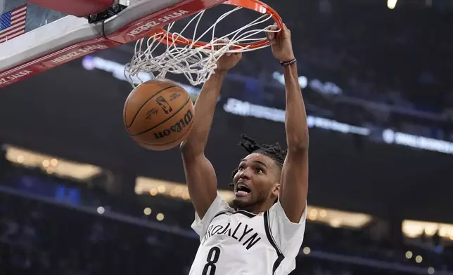 Brooklyn Nets forward Ziaire Williams dunks during the first half of an NBA basketball game against the Los Angeles Clippers, Wednesday, Jan. 15, 2025, in Inglewood, Calif. (AP Photo/Mark J. Terrill)