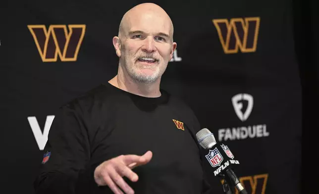 Washington Commanders head coach Dan Quinn speaks at a news conference after an NFL wild-card playoff football game against the Tampa Bay Buccaneers in Tampa, Fla., Sunday, Jan. 12, 2025. (AP Photo/Jason Behnken)