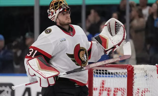 Ottawa Senators goaltender Anton Forsberg (31) pauses after giving up a goal to St. Louis Blues' Brandon Saad during the second period of an NHL hockey game Friday, Jan. 3, 2025, in St. Louis. (AP Photo/Jeff Roberson)