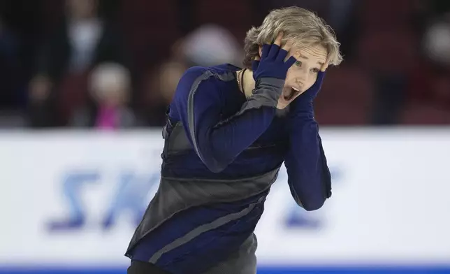 Ilia Malinin reacts after performing in the men's short program competition at the U.S. figure skating championships Saturday, Jan. 25, 2025, in Wichita, Kan. (AP Photo/Travis Heying)