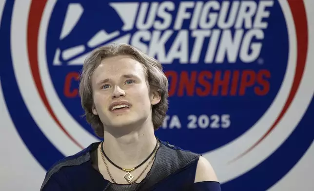 Ilia Malinin waits for his score after performing in the men's short program competition at the U.S. figure skating championships Saturday, Jan. 25, 2025, in Wichita, Kan. (AP Photo/Travis Heying)