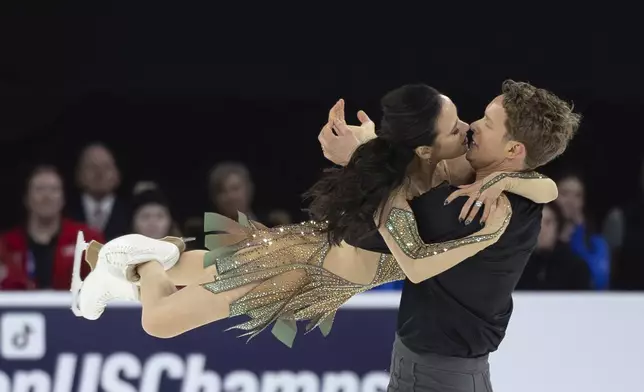 Madison Chock, left, and Evan Bates, right, perform during the ice dance free dance program competition at the U.S. figure skating championships Saturday, Jan. 25, 2025, in Wichita, Kan. (AP Photo/Travis Heying)