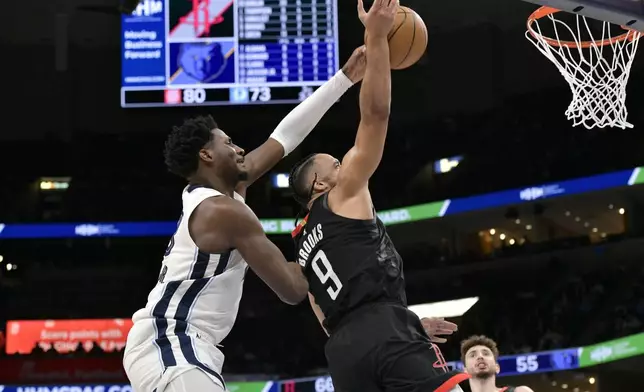 Memphis Grizzlies forward Jaren Jackson Jr., left, blocks a shot by Houston Rockets forward Dillon Brooks (9) in the first half of an NBA basketball game Thursday, Jan. 9, 2025, in Memphis, Tenn. (AP Photo/Brandon Dill)