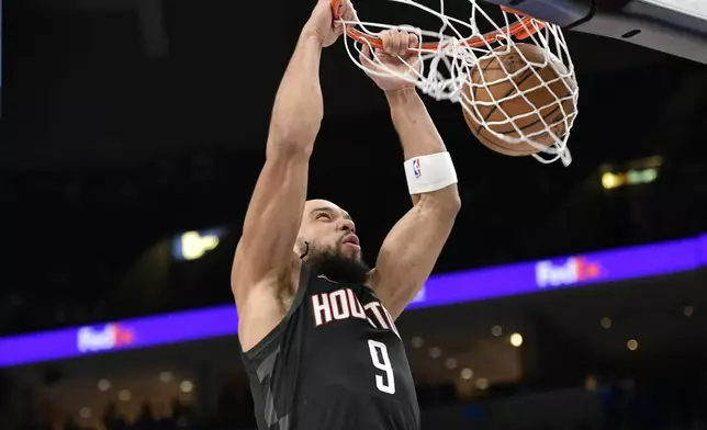 Houston Rockets forward Dillon Brooks (9) dunks the ball in the first half of an NBA basketball game against the Memphis Grizzlies Thursday, Jan. 9, 2025, in Memphis, Tenn. (AP Photo/Brandon Dill)