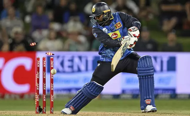 Sri Lanka's Wanindu Hasaranga is bowled by New Zealand's Jacob Duffy, during the second Twenty20 international cricket match between New Zealand and Sri Lanka at Mt. Maunganui, New Zealand, Monday, Dec. 30, 2024. (Andrew Cornaga/Photosport via AP)