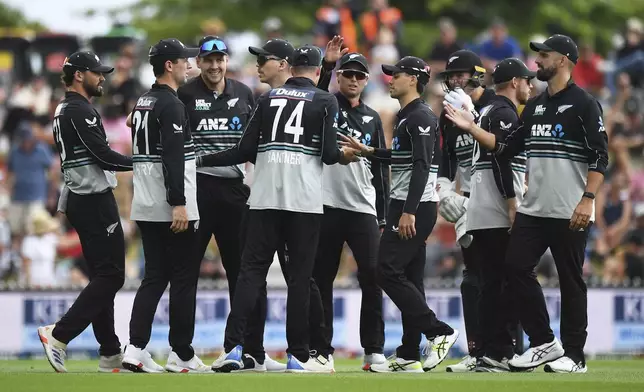 New Zealand players celebrate the wicket of Sri Lanka player Kusal Mendis during the 3rd T20 match between New Zealand and Sri Lanka at Saxton Oval in Nelson, New Zealand, Thursday, Jan. 2, 2025. (Chris Symes/Photosport via AP)