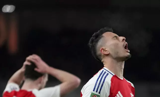 Arsenal's Gabriel Martinelli, right, reacts after a missed opportunity during the English League Cup semifinal first leg soccer match between Arsenal and Newcastle United at the Emirates stadium in London, Tuesday, Jan. 7, 2025. (AP Photo/Kirsty Wigglesworth)