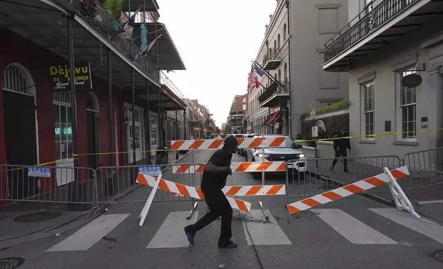 A police barricade near the scene after a vehicle drove into a crowd on New Orleans' Canal and Bourbon Street, Wednesday Jan. 1, 2025. (AP Photo/Gerald Herbert)