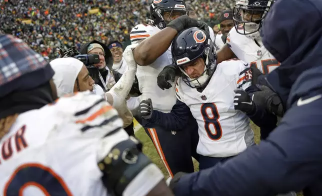 Chicago Bears' Cairo Santos is congratulated after making the game-winning field goal at the end of an NFL football game against the Green Bay Packers Sunday, Jan. 5, 2025, in Green Bay, Wis. (AP Photo/Matt Ludtke)