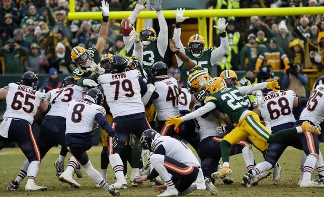 Chicago Bears place kicker Cairo Santos (8) kicks a field goal against the Green Bay Packers during the second half of an NFL football game, Sunday, Jan. 5, 2025, in Green Bay, Wis. (AP Photo/Mike Roemer)