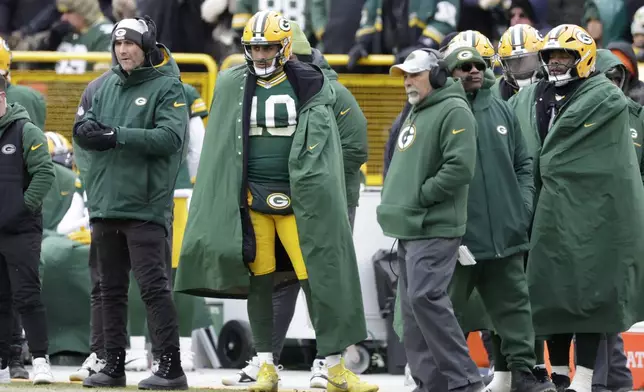 Green Bay Packers quarterback Jordan Love (10) watches from the sideline during the first half of an NFL football game against the Chicago Bears, Sunday, Jan. 5, 2025, in Green Bay, Wis. (AP Photo/Matt Ludtke)