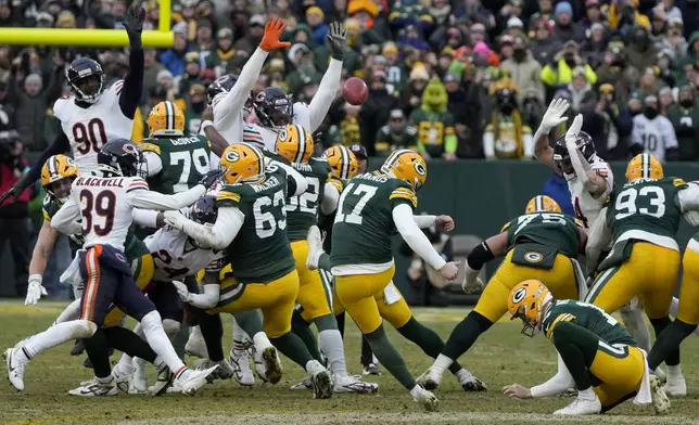 Green Bay Packers place kicker Brandon McManus (17) kicks a field goal during the second half of an NFL football game against the Chicago Bears, Sunday, Jan. 5, 2025, in Green Bay, Wis. (AP Photo/Morry Gash)