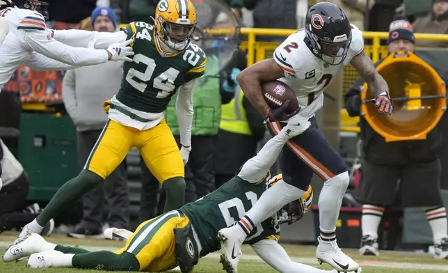 Chicago Bears wide receiver DJ Moore (2) runs against Green Bay Packers safety Javon Bullard, bottom, during the first half of an NFL football game, Sunday, Jan. 5, 2025, in Green Bay, Wis. (AP Photo/Morry Gash)