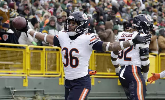 Chicago Bears safety Jonathan Owens (36) celebrates after recovering a fumble against the Green Bay Packers during the first half of an NFL football game, Sunday, Jan. 5, 2025, in Green Bay, Wis. (AP Photo/Matt Ludtke)