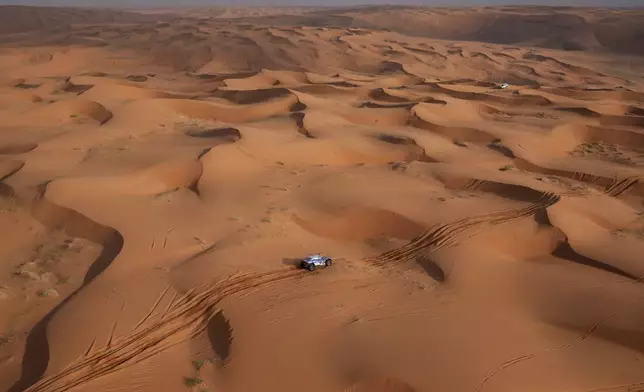 Driver Toby Price and co-driver Sam Sunderland compete during the sixth stage of the Dakar Rally between Hail and Al Duwadimi, Saudi Arabia, Saturday, Jan. 11, 2025. (AP Photo/Christophe Ena)