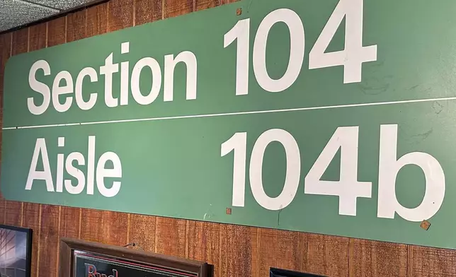 A sign listing the section in which Detroit Lions fan Rob Gonzales once owned season tickets at the Pontiac Silverdome is displayed in the basement of his home Thursday, Jan. 16, 2025, in Frenchtown Township, Mich. (AP Photo/Mike Householder)