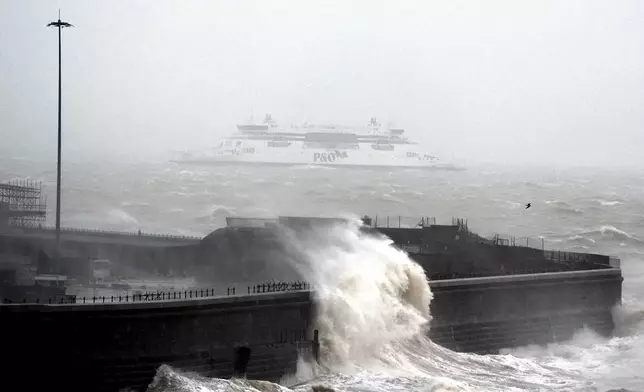 A ferry heads out to sea as weather warnings are enforced across parts of the UK, in Dover, England, Wednesday, Jan. 1, 2025. (Gareth Fuller/PA via AP)