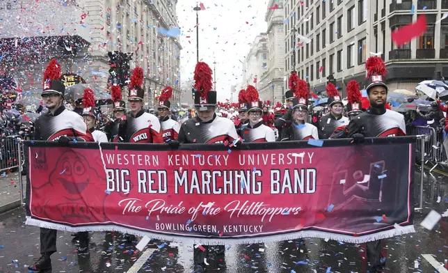 Marching band members from Western Kentucky University walk in the rain during the New Year's Day Parade in central London, Wednesday Jan. 1, 2025. (Jonathan Brady/PA via AP)