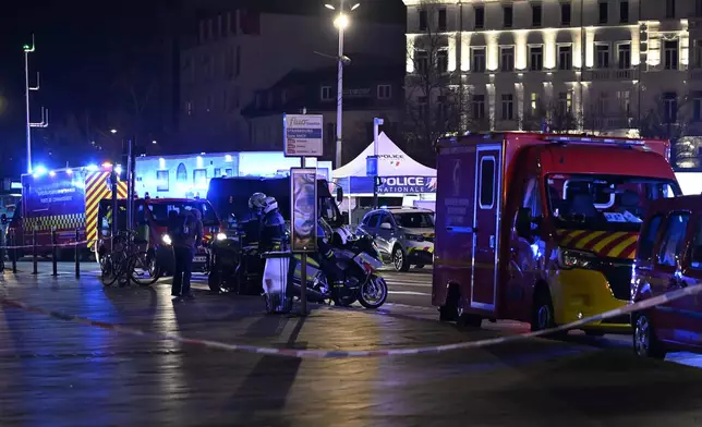 Police officers block the access to the station after two trams collided, injuring dozens of people, though none critically, firefighters said, Saturday, Jan. 11, 2025 in Strasbourg, eastern France. (AP Photo/Pascal Bastien)