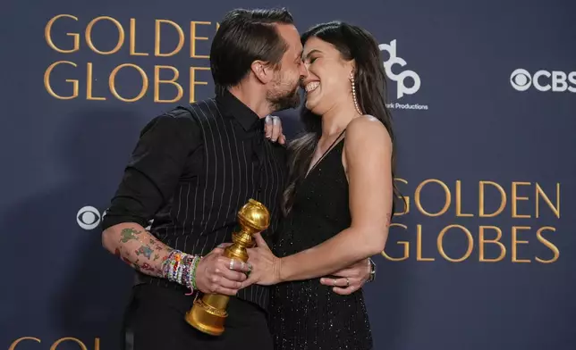 Kieran Culkin, right, winner of the award for best performance by an actor in a supporting role in any motion picture for "A Real Pain" poses with Jazz Charton during the 82nd Golden Globes on Sunday, Jan. 5, 2025, at the Beverly Hilton in Beverly Hills, Calif. (AP Photo/Chris Pizzello)