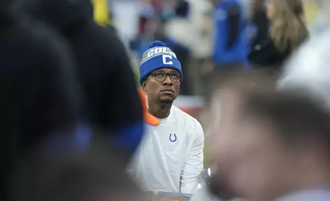 Indianapolis Colts quarterback Anthony Richardson (5), not playing because of an injury, looks out from the sidelines of an NFL football game against the Jacksonville Jaguars, Sunday, Jan. 5, 2025, in Indianapolis. (AP Photo/Darron Cummings)