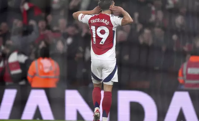 Arsenal's Leandro Trossard celebrates after scoring his side's second goal during the English Premier League soccer match between Arsenal and Tottenham Hotspur at the Emirates Stadium, London, Wednesday, Jan. 15, 2025. (Bradley Collyer/PA via AP)