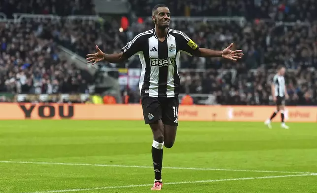 Newcastle United's Alexander Isak celebrates after scoring the opening goal during the English Premier League soccer match between Newcastle United and Wolverhampton Wanderers at St. James' Park, Newcastle, England, Wednesday, Jan. 15, 2025. (Owen Humphreys/PA via AP)