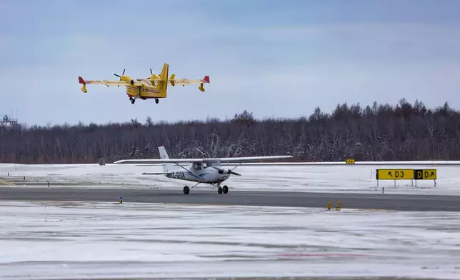A SOPFEU CL-415 is taking off to help in the California wildfires at the Quebec City airport, Wednesday, Jan. 15, 2025. (Francis Vachon/The Canadian Press via AP)