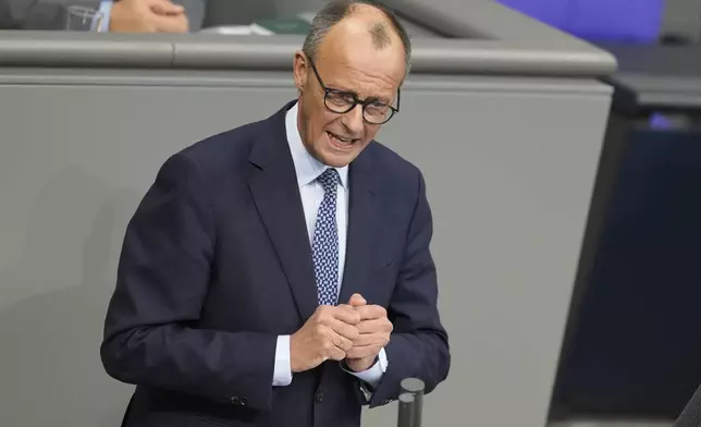 German opposition leader and Christian Union parties floor leader Friedrich Merz speaks at a debate about migration at the German parliament Bundestag in Berlin, Germany, Wednesday, Jan. 29, 2025. (AP Photo/Markus Schreiber)