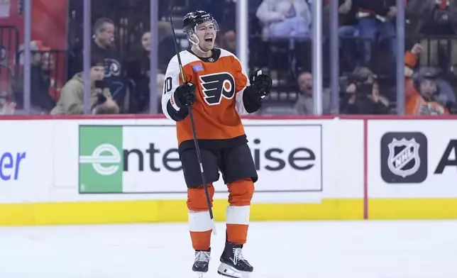 Philadelphia Flyers' Bobby Brink reacts after scoring a goal during the first period of an NHL hockey game against the New Jersey Devils, Monday, Jan. 27, 2025, in Philadelphia. (AP Photo/Matt Slocum)