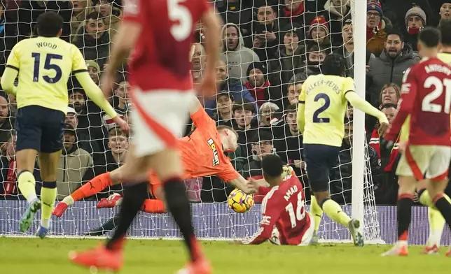 Manchester United's Amad Diallo, centre, scores his side's second goal during the English Premier League soccer match between Manchester United and Southampton at the Old Trafford stadium in Manchester, England, Thursday, Jan. 16, 2025. (AP Photo/Dave Thompson)