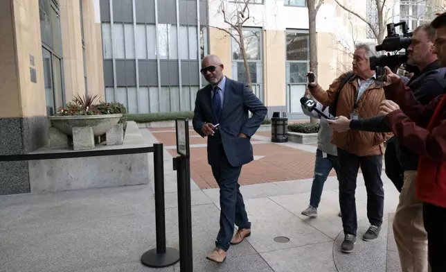 Andre Jones, along with his partner Sheng Thao, the former mayor of Oakland were criminally indicted by a federal grand jury after an FBI corruption investigation, arrives at the United States District Court in Oakland, Calif., on Friday, Jan. 17, 2025. (Santiago Mejia/San Francisco Chronicle via AP)