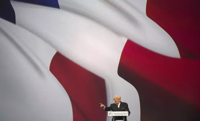 FILE - French far-right Front National former leader Jean-Marie Le Pen delivers a speech during the 15th congress of the party, in Lyon, central France, Saturday, Nov. 29, 2014. (AP Photo/Laurent Cipriani, File)