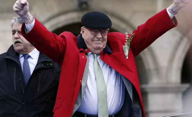 FILE - Former far-right National Front party leader Jean-Marie Le Pen reacts the statue of Joan of Arc, in Paris, on May 1, 2017. (AP Photo/Thibault Camus, File)