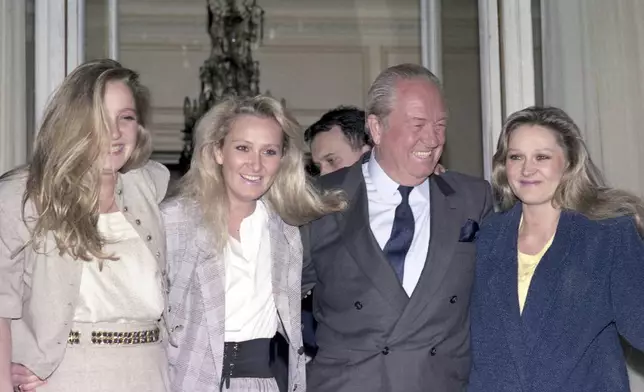 FILE - President of the French National Front Jean Marie Le Pen with his daughters, left to right, Marine, Yann and Marie Caroline on April 24, 1988,. (AP Photo/Olivier Boitet, File)