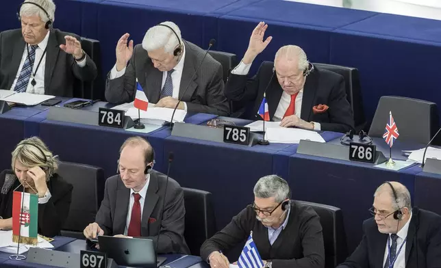 FILE - Former far-right National Front party leader Jean-Marie Le Pen, top right, attends his last plenary session at the European Parliament in Strasbourg, aastern France, Tuesday April 16, 2019. (AP Photo/Jean-Francois Badias, File)