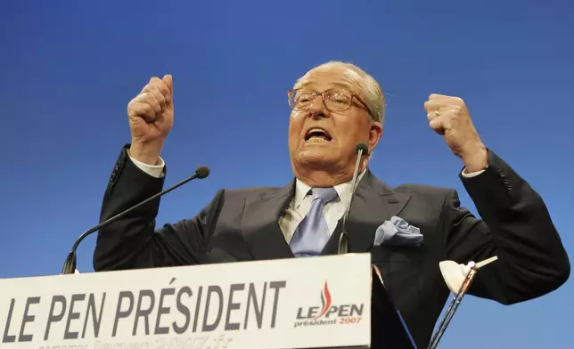 FILE - French far-right leader and presidential candidate Jean-Marie Le Pen gestures as he delivers a speech after the announcement of the preliminary official results of the election's first round, Sunday, April 22, 2007 in Paris. (AP Photo/Michael Sawyer, File)